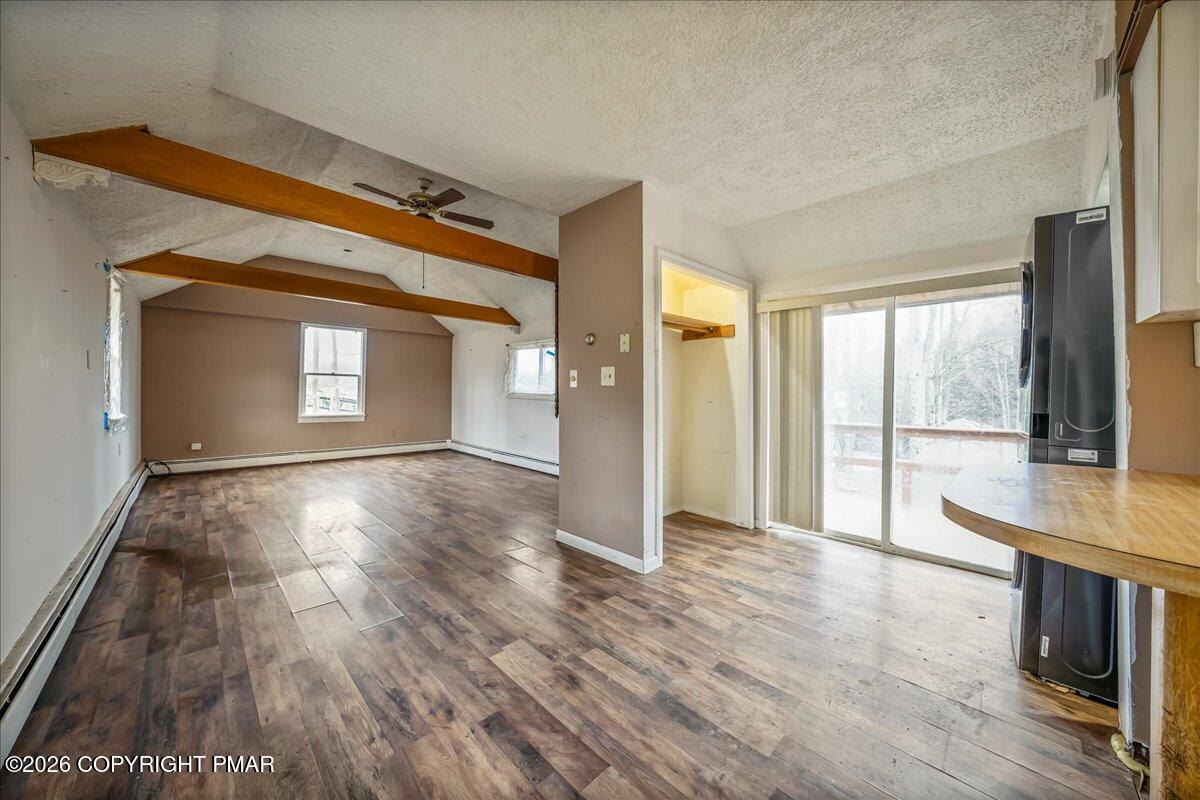 1191 Aberdeen Road Moscow, PA 18444 - Photo 2 of 19 a view of empty room with wooden floor and fan