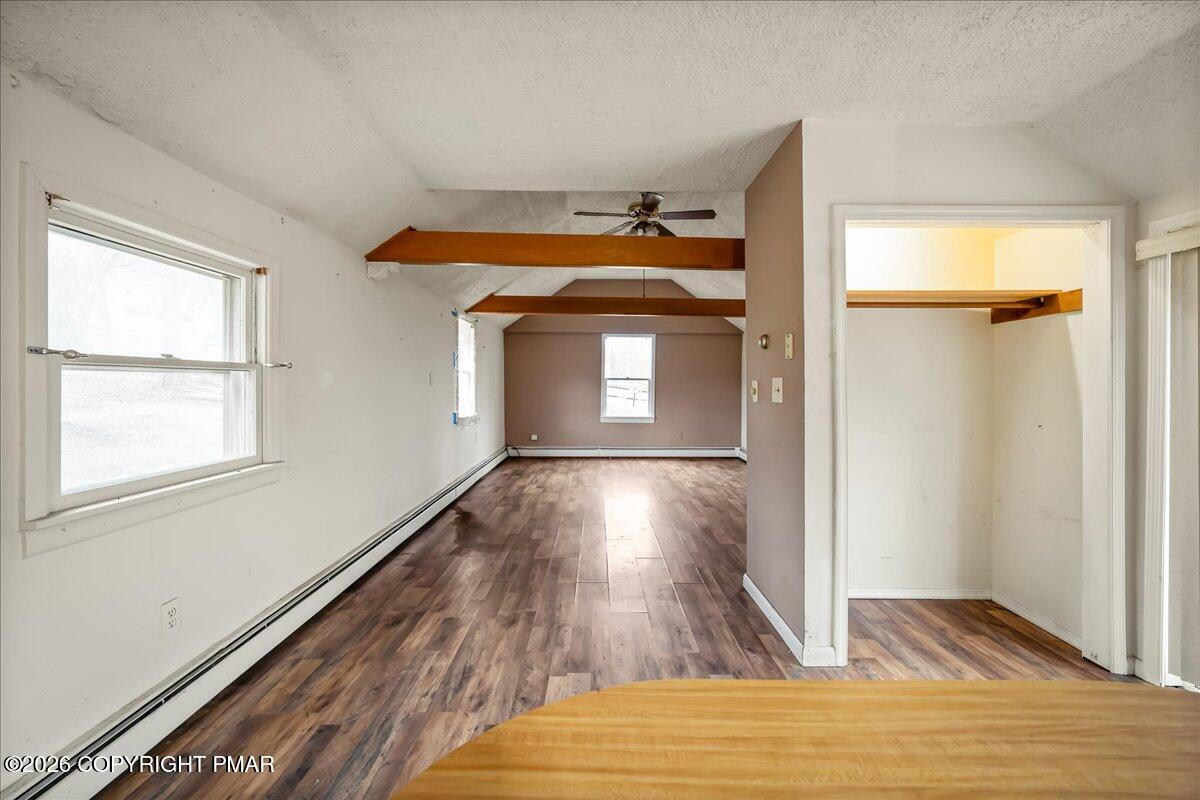 1191 Aberdeen Road Moscow, PA 18444 - Photo 3 of 19 a view of empty room with wooden floor and fan