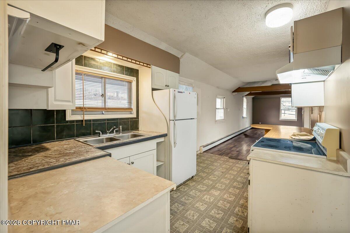 1191 Aberdeen Road Moscow, PA 18444 - Photo 9 of 19 a kitchen with granite countertop a sink stainless steel appliances and cabinets