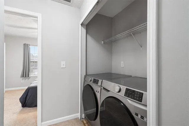 a utility room with dryer and washer