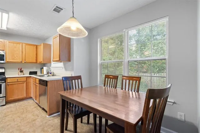 a view of a dining room with furniture window and outside view