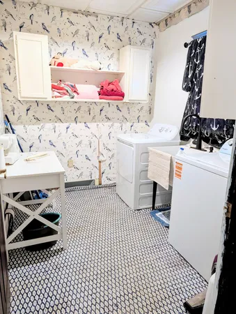 a bedroom with a bed and a night stand