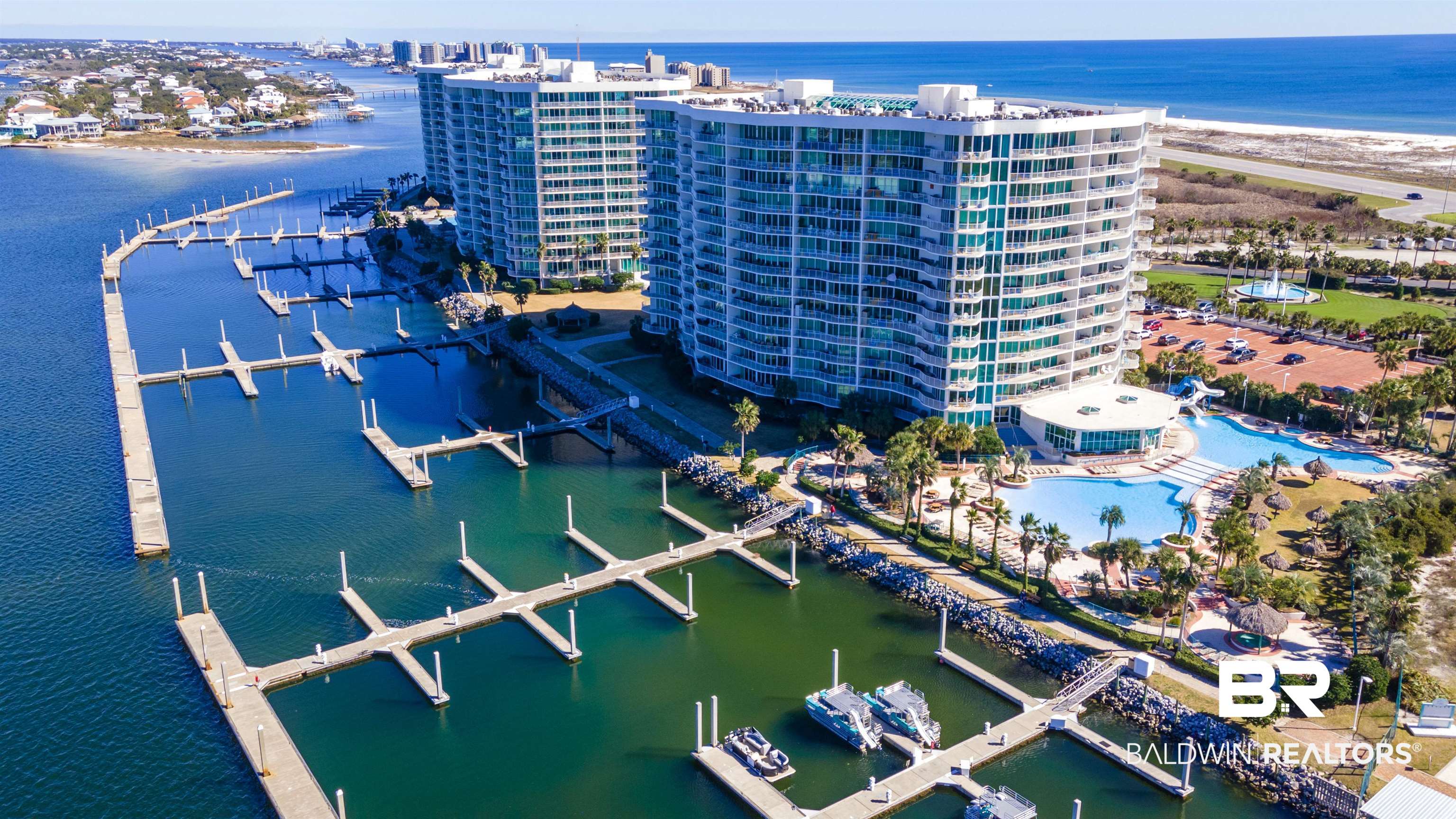 28107 Perdido Beach Boulevard, Unit DPH05 Orange Beach, AL 36561 - Photo 36 of 43 Drone / aerial view of a large body of water and apartment complex