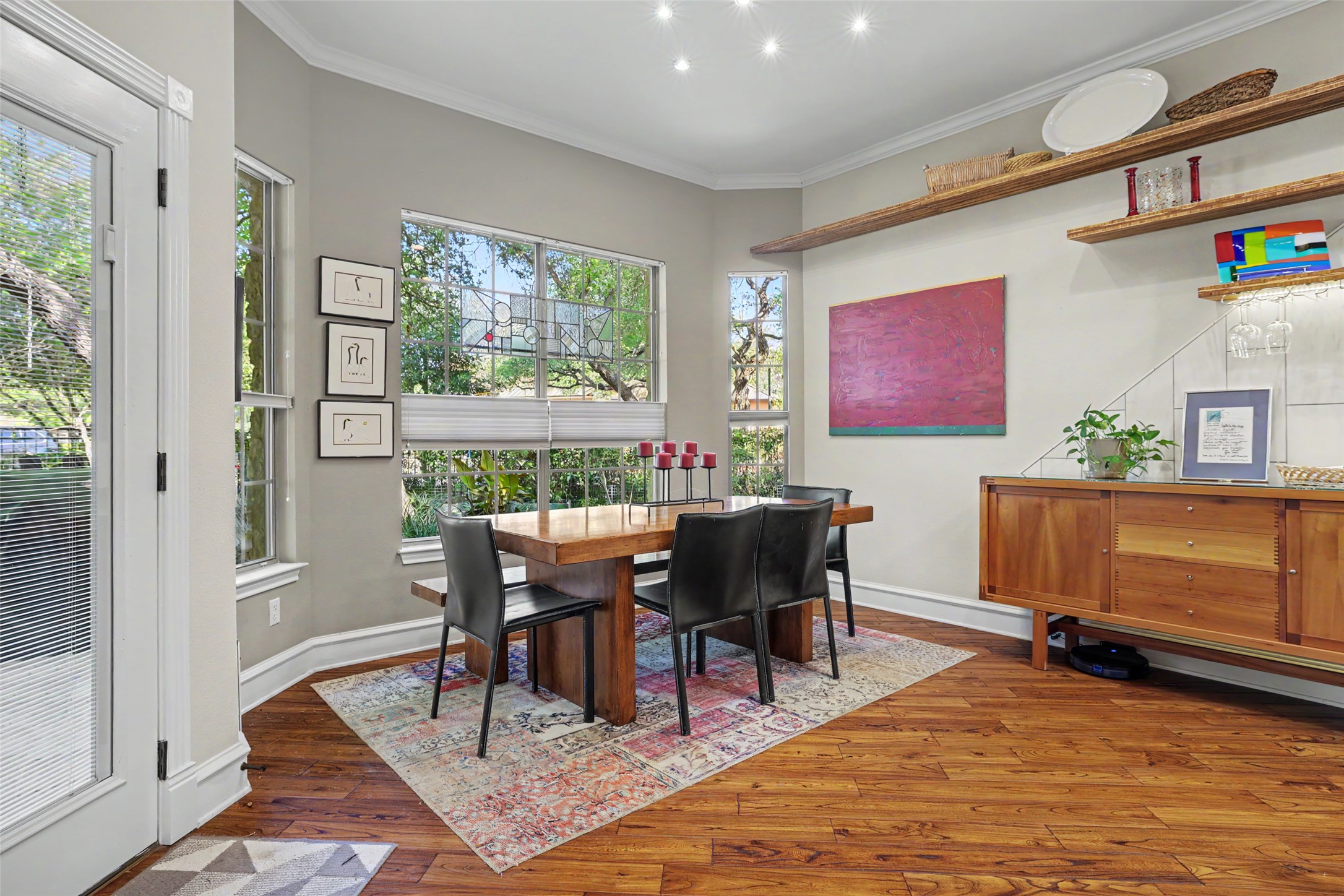 805 Boquilla Trail Georgetown, TX 78633 - Photo 13 of 40 a view of a dining room with furniture window and wooden floor