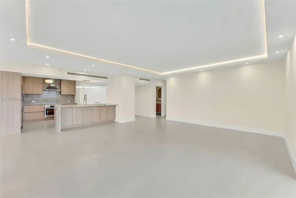 a view of a kitchen with a sink and cabinets