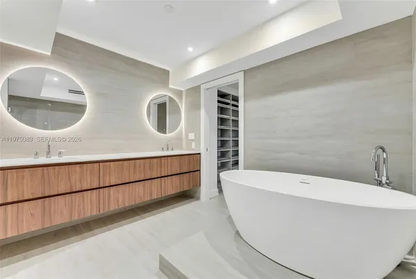 a bathroom with a bathtub and a sink
