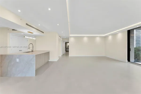 a view of kitchen with stainless steel appliances cabinets and outdoor view