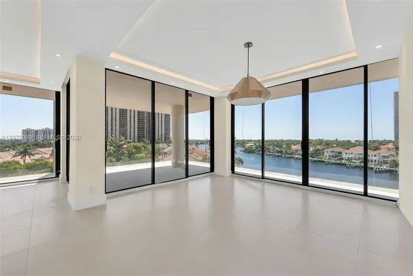 a view of an empty room window and a glass door