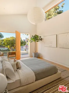 a view of a balcony with floor to ceiling window and outdoor space