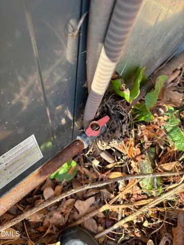 a room with water heater and a window