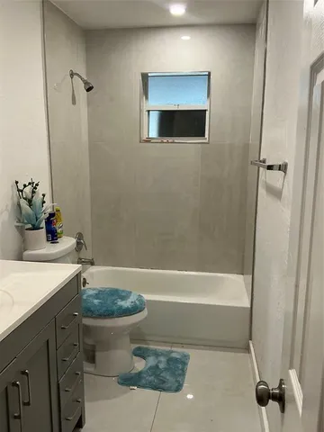 a bath room with a sink and a toilet
