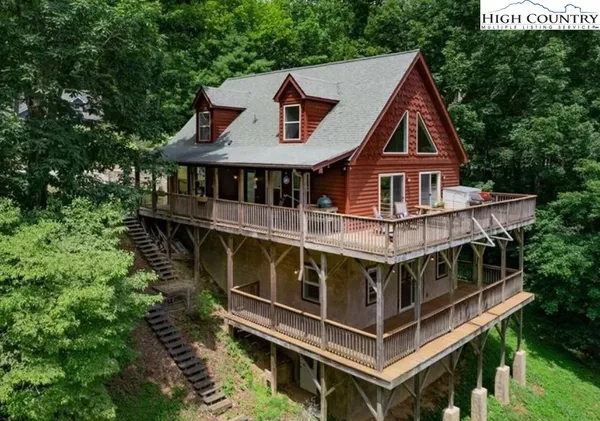 an aerial view of a house with roof deck