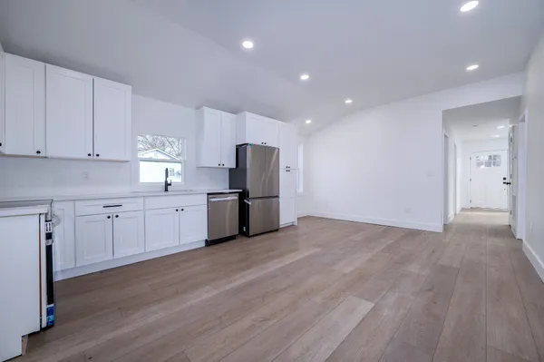 a view of a kitchen with electric appliances