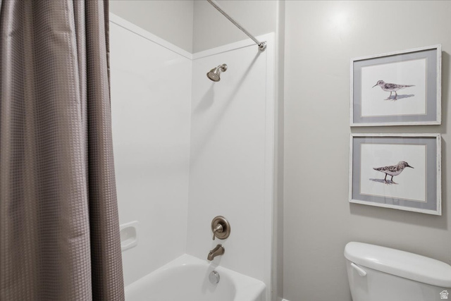 1257 Rigby Road Kaysville, UT 84037 - Photo 33 of 55 Bathtub with integrated shower surround, brushed nickel fixtures, and a white toilet