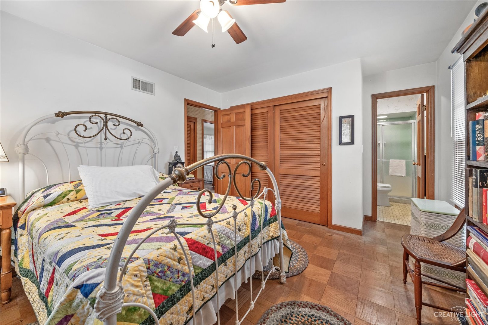 1268 North Randall Road Aurora, IL 60506 - Photo 19 of 28 a bedroom with a bed and a chandelier