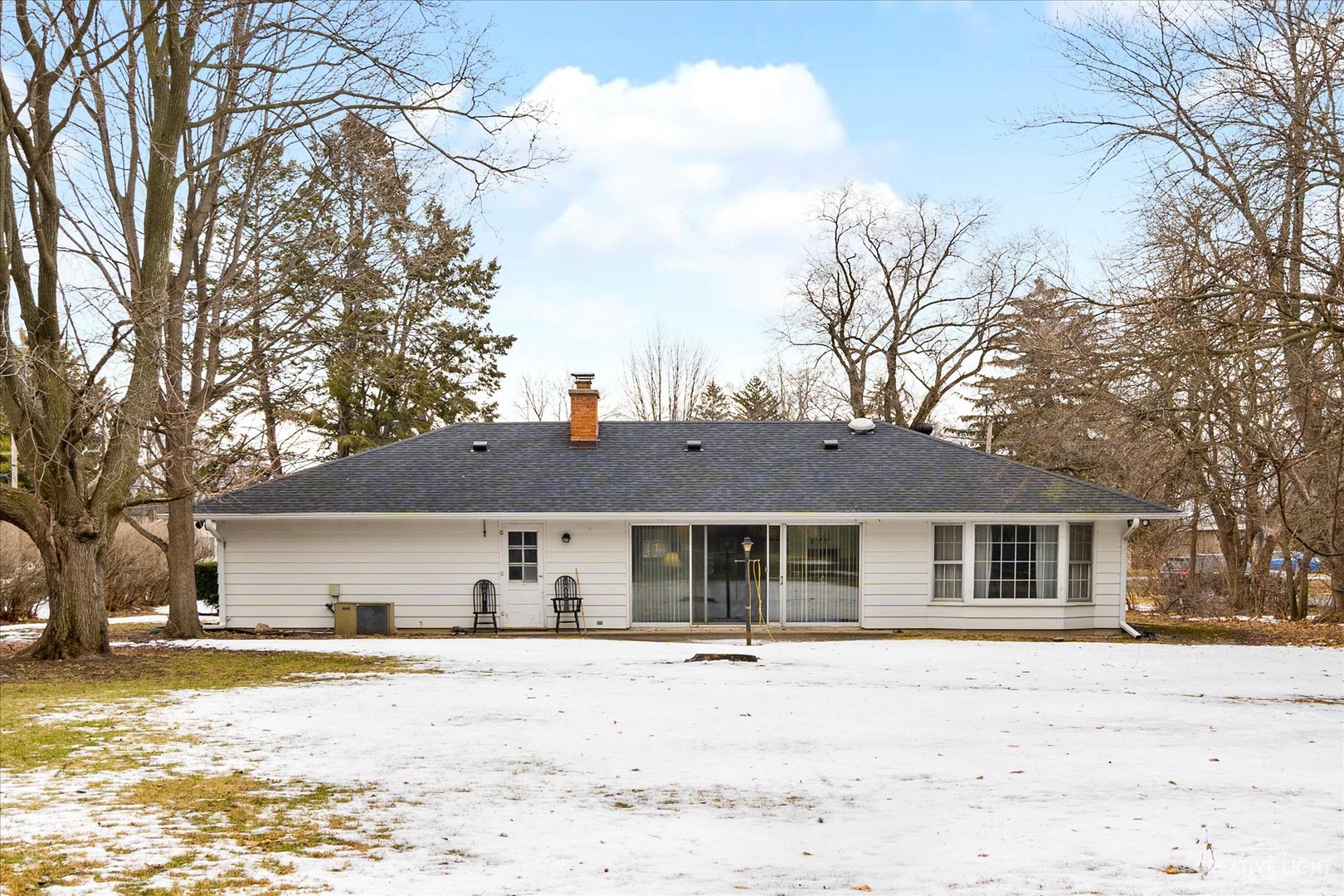 1268 North Randall Road Aurora, IL 60506 - Photo 23 of 28 a front view of a house with a yard covered in snow