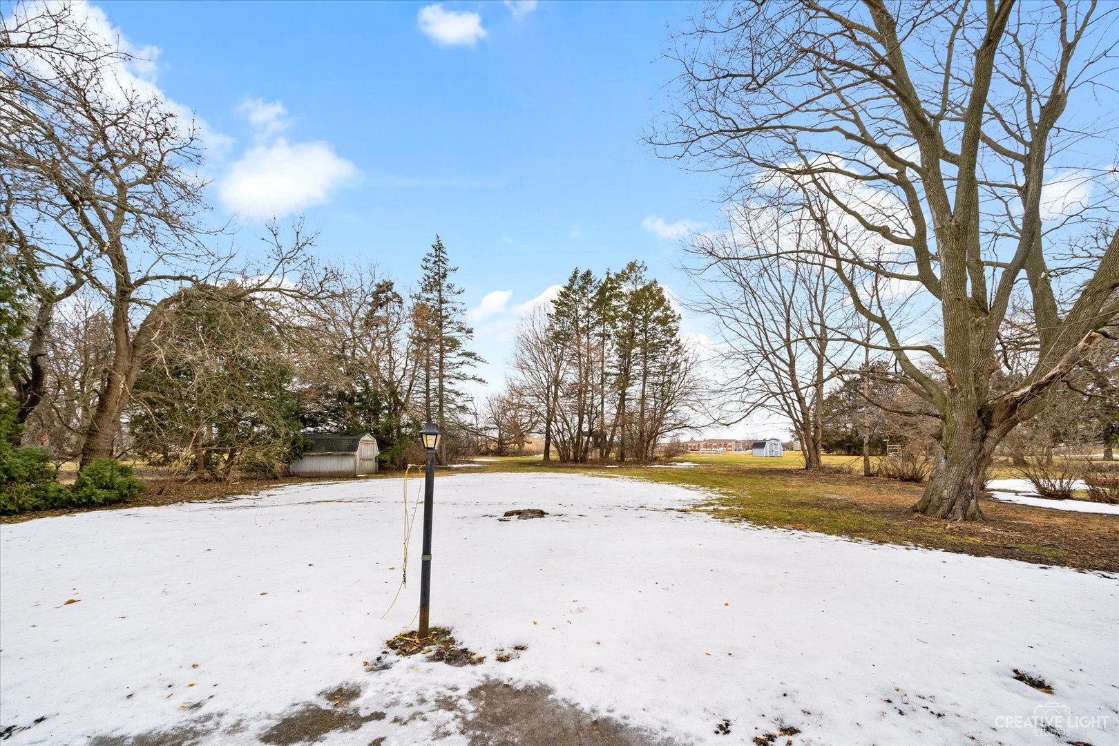 1268 North Randall Road Aurora, IL 60506 - Photo 24 of 28 a street view of the road and trees