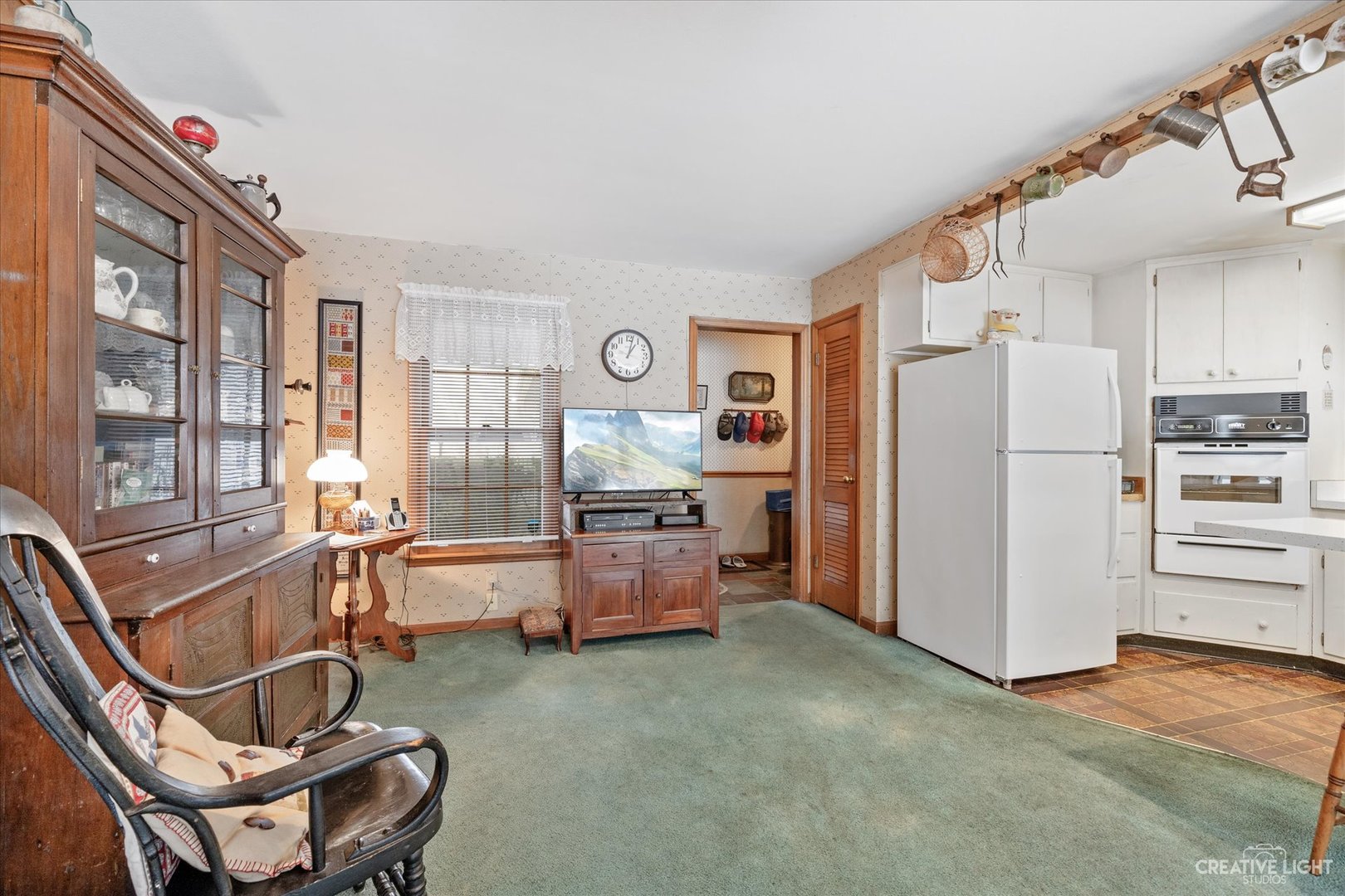 1268 North Randall Road Aurora, IL 60506 - Photo 4 of 28 a kitchen with refrigerator and chairs