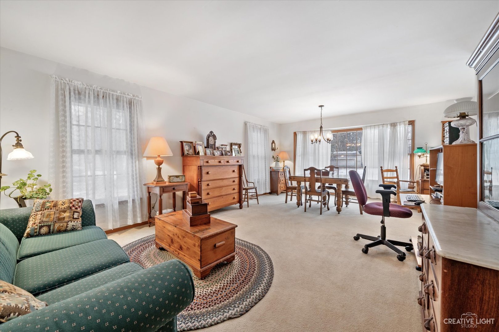 1268 North Randall Road Aurora, IL 60506 - Photo 5 of 28 a living room with furniture and gym equipment