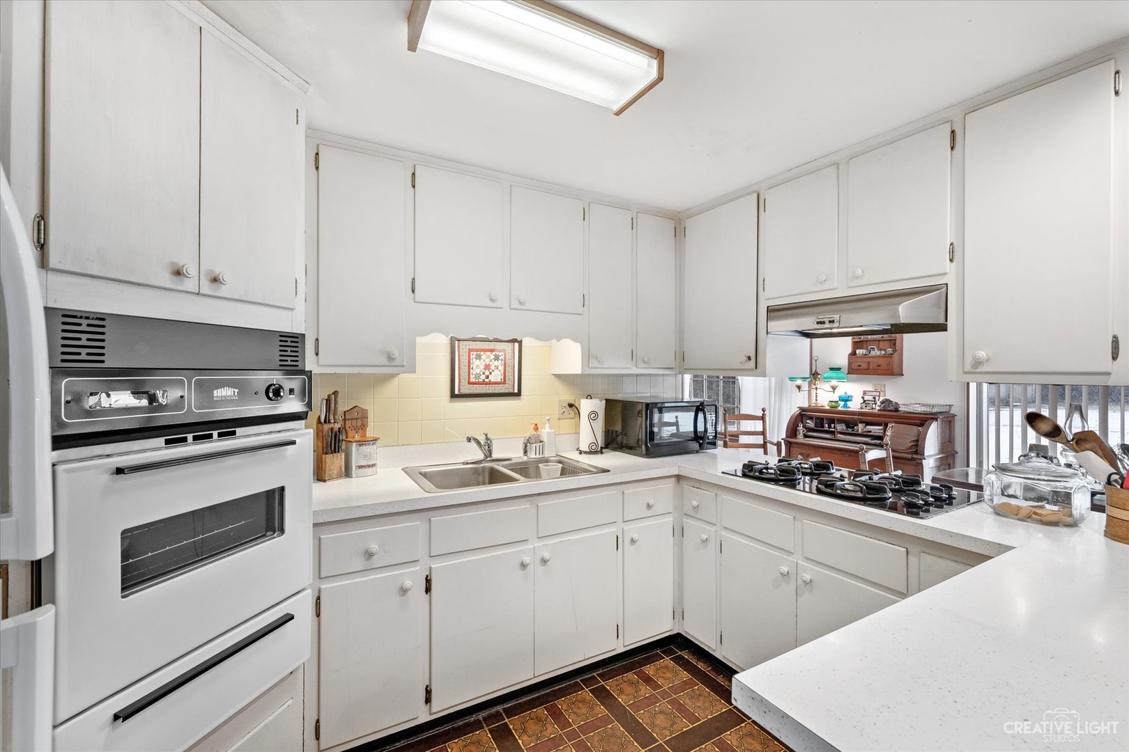 1268 North Randall Road Aurora, IL 60506 - Photo 7 of 28 a kitchen with cabinets appliances a sink and a counter space