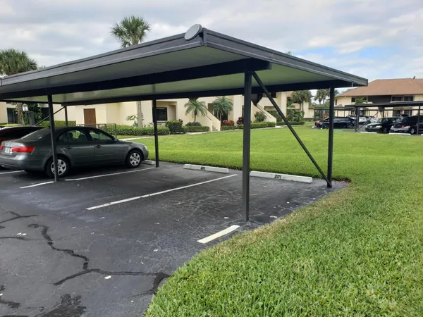 a view of yard with a car parked