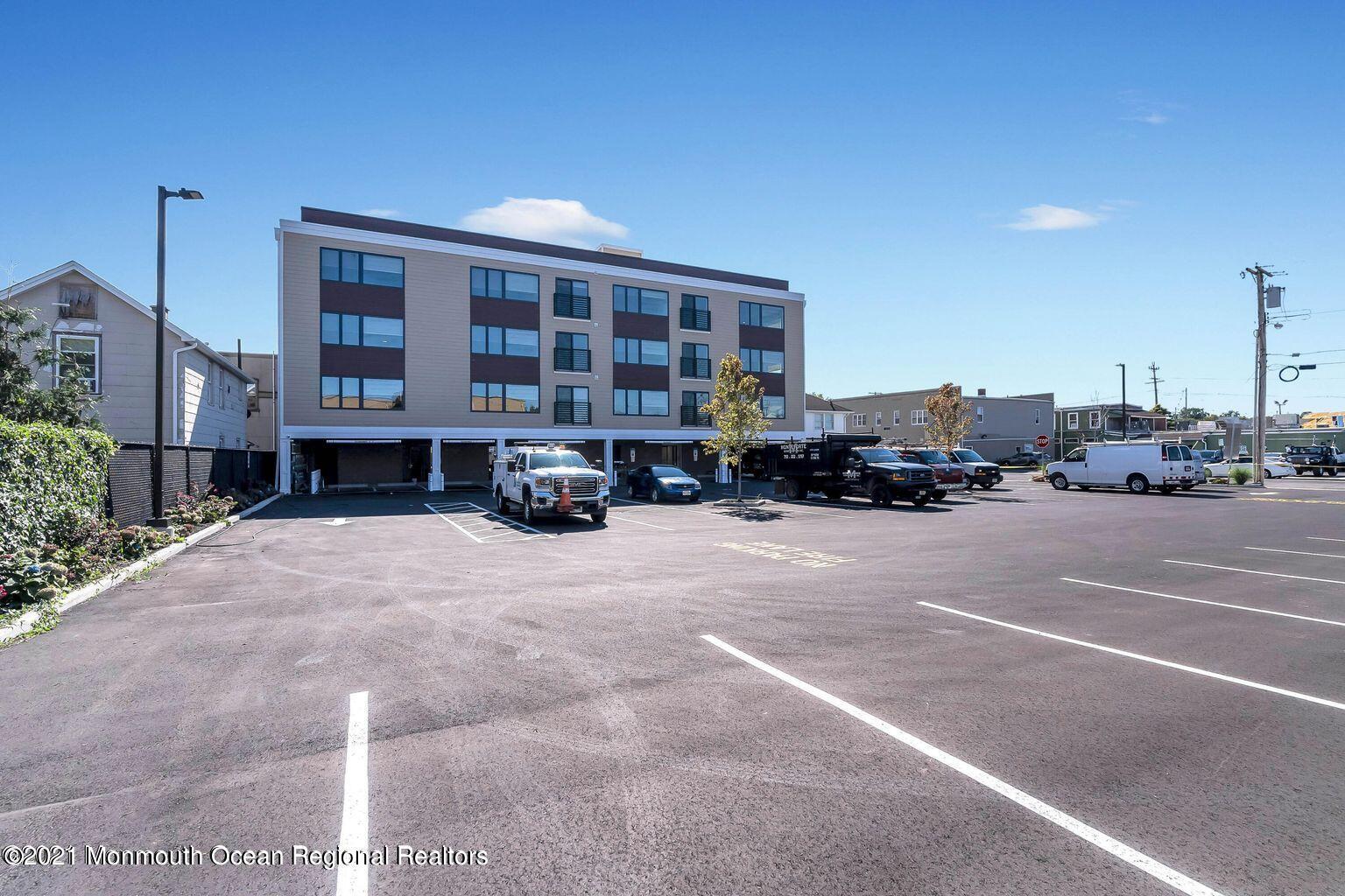 131 Brighton Avenue, Unit 301 Long Branch, NJ 07740 - Photo 27 of 31 a cars parked in front of a building