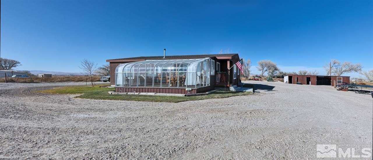 5954 Workman Road Fallon, NV 89406 - Photo 1 of 21 a view of a house with a yard