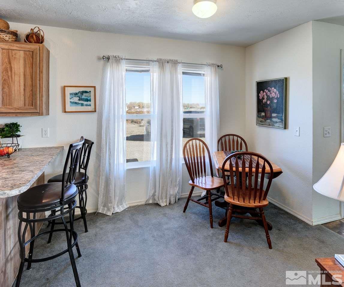 5954 Workman Road Fallon, NV 89406 - Photo 6 of 21 a view of a livingroom with furniture a wooden table and chair