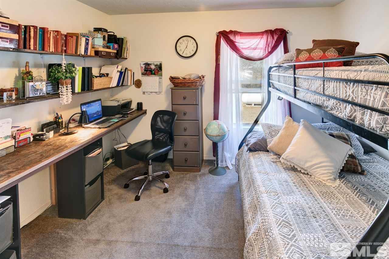 5954 Workman Road Fallon, NV 89406 - Photo 9 of 21 a view of a workspace with furniture and a couch