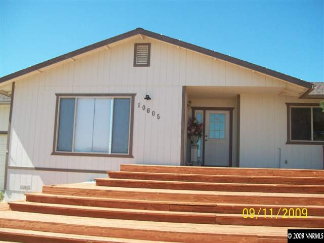 10605 North Red Rock Road Reno, NV 89508 - Photo 1 of 9 a view of a house with a balcony