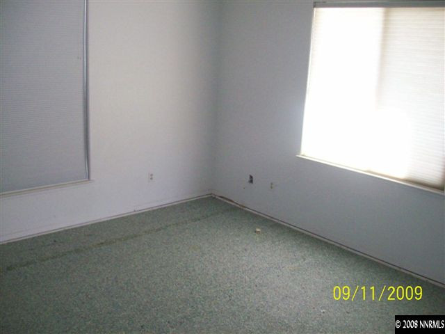 10605 North Red Rock Road Reno, NV 89508 - Photo 4 of 9 an empty room with a window