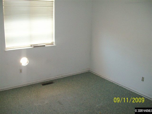 10605 North Red Rock Road Reno, NV 89508 - Photo 6 of 9 an empty room with a window