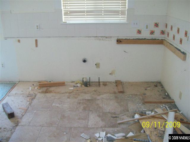 10605 North Red Rock Road Reno, NV 89508 - Photo 9 of 9 a bathroom with a sink and a window