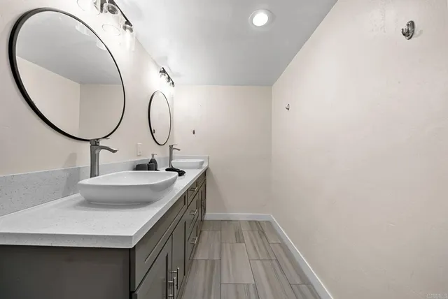 a bathroom with a shower and a sink