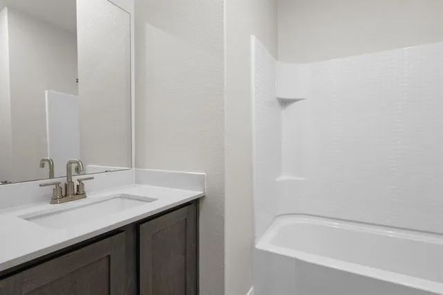 a bathroom with a sink and a bathtub