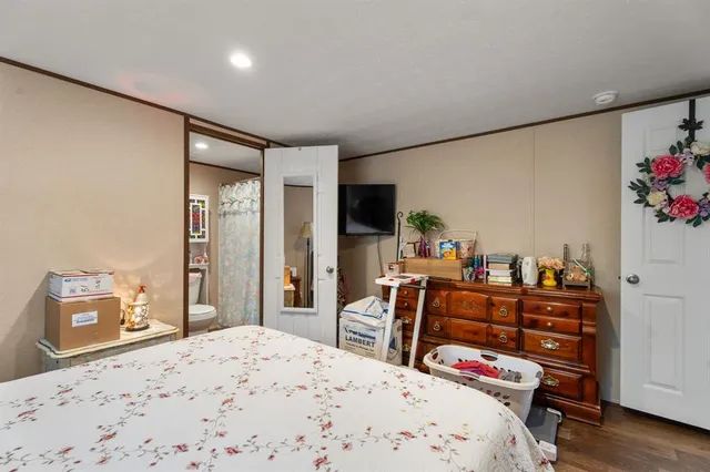 a bedroom with a bed and furniture