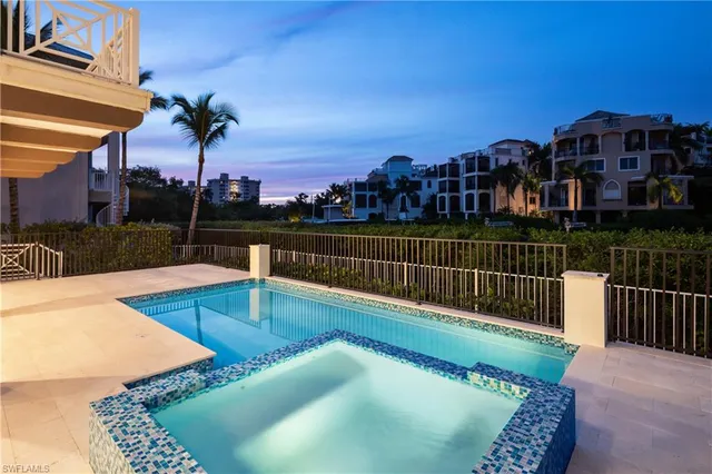 a view of a swimming pool with a lounge chairs