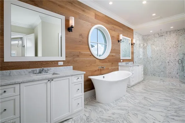 a bathroom with a bathtub sink and mirror