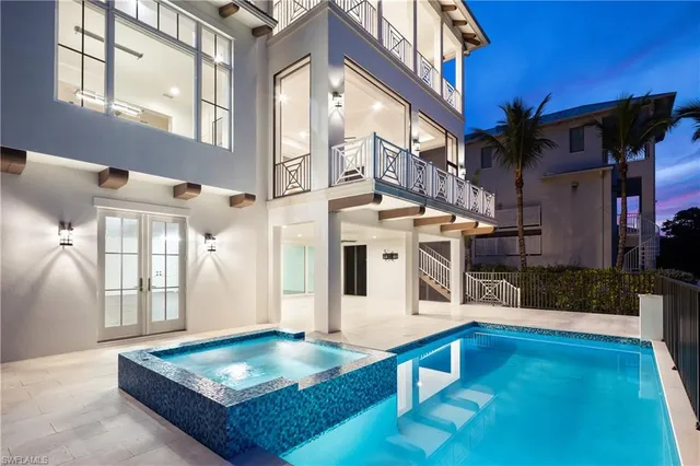 a view of living room kitchen and entryway