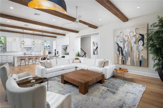 a living room with furniture and a rug