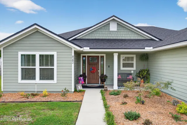 a living room with furniture a flat screen tv and gym equipment
