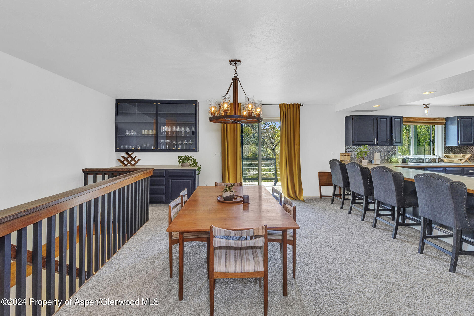 674 Mesa Court Rifle, CO 81650 - Photo 14 of 38 a dining room with furniture a chandelier and window