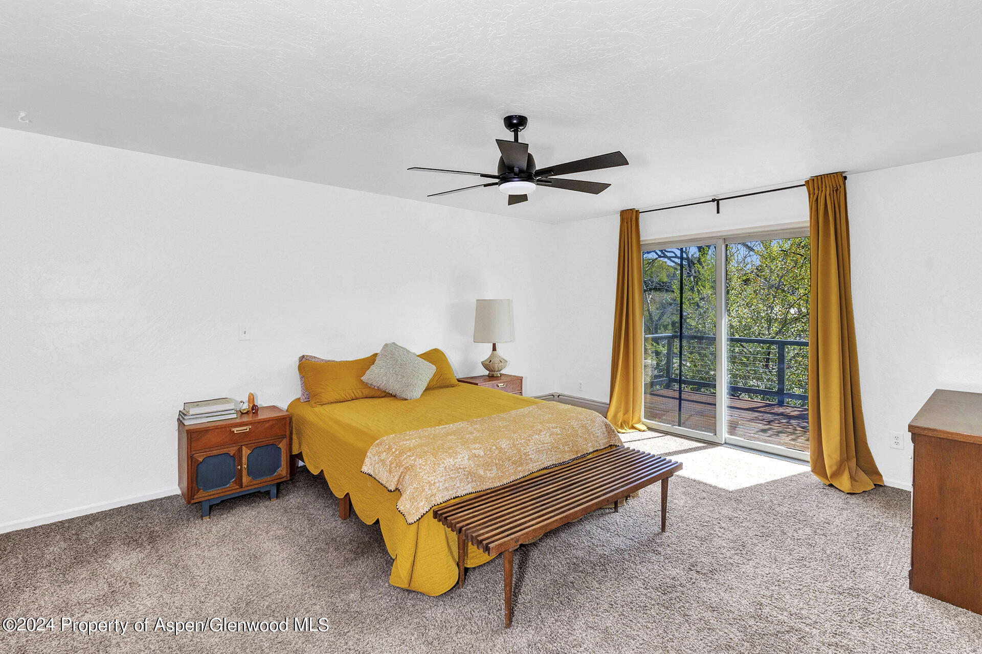 674 Mesa Court Rifle, CO 81650 - Photo 15 of 38 a bedroom with a bed and large window