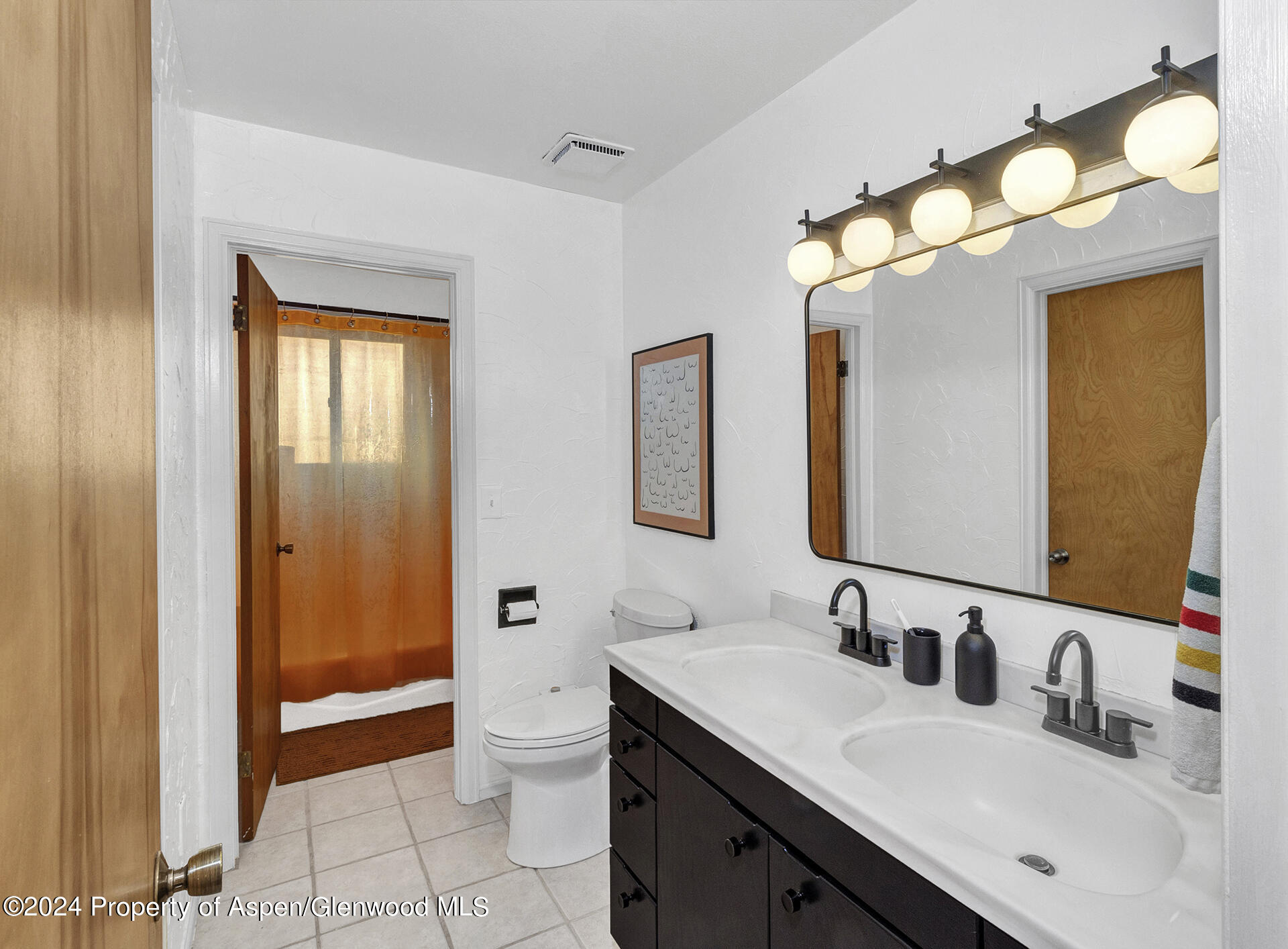 674 Mesa Court Rifle, CO 81650 - Photo 18 of 38 a bathroom with a sink a toilet and shower