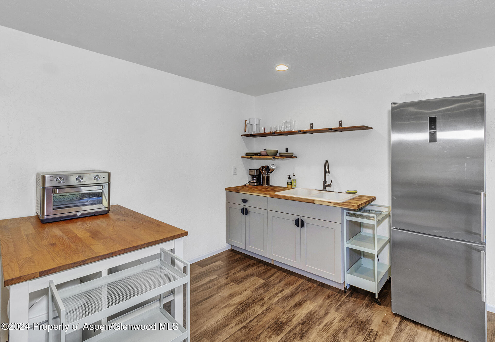 674 Mesa Court Rifle, CO 81650 - Photo 22 of 38 a view of kitchen with cabinets and wooden floor