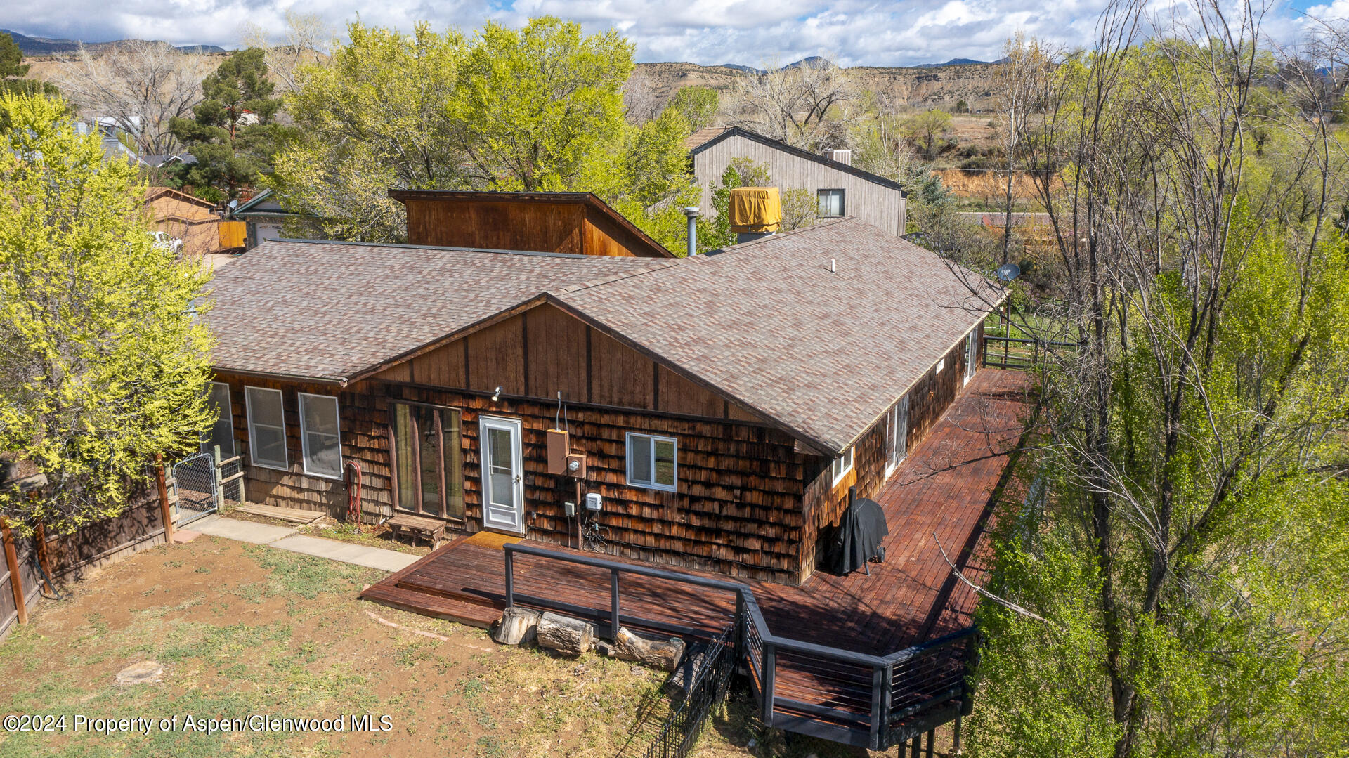 674 Mesa Court Rifle, CO 81650 - Photo 35 of 38 a aerial view of a house with large trees