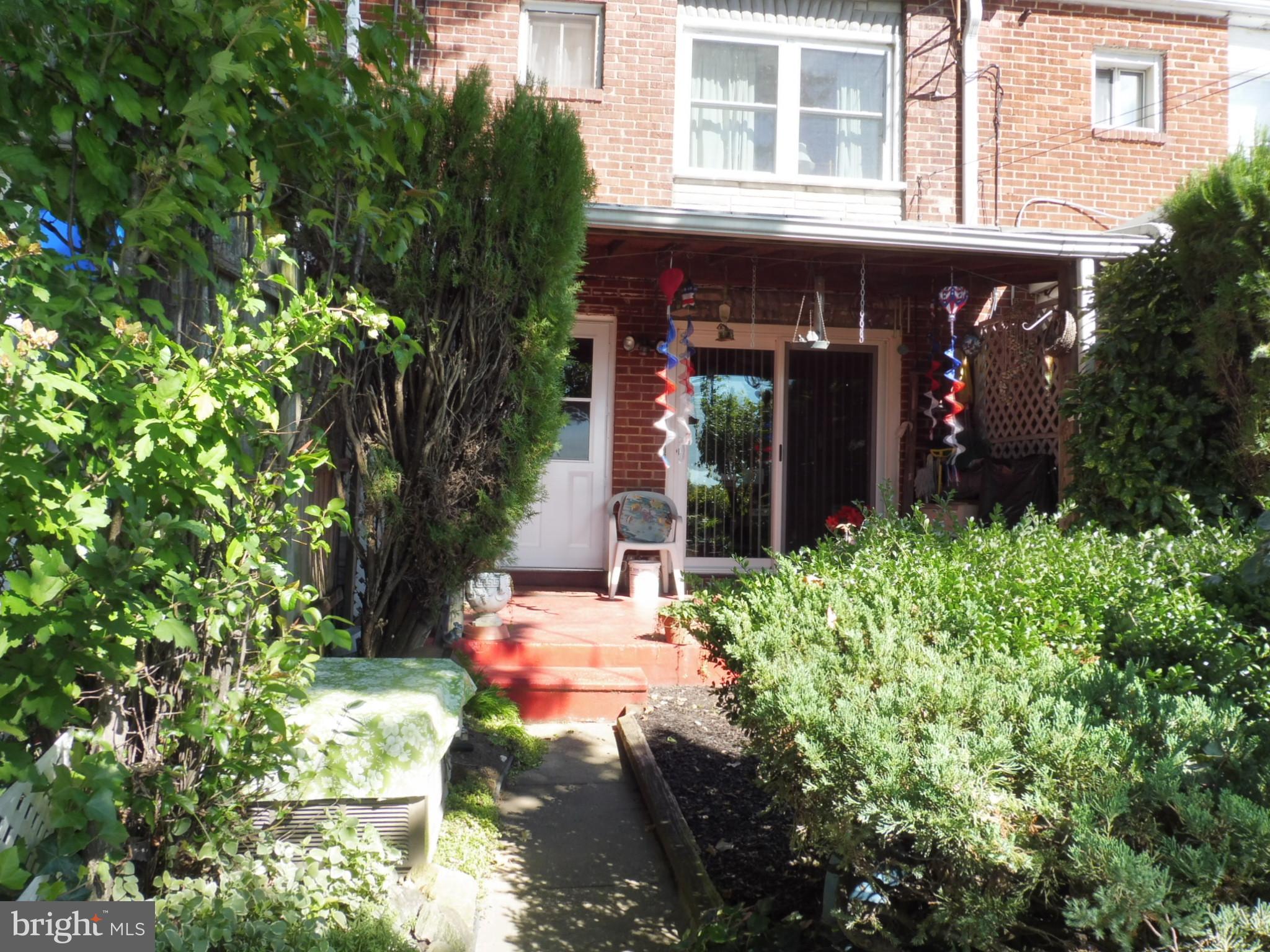 2138 Jasmine Road Baltimore, MD 21222 - Photo 3 of 24 Lush rear garden & covered porch for sunset views