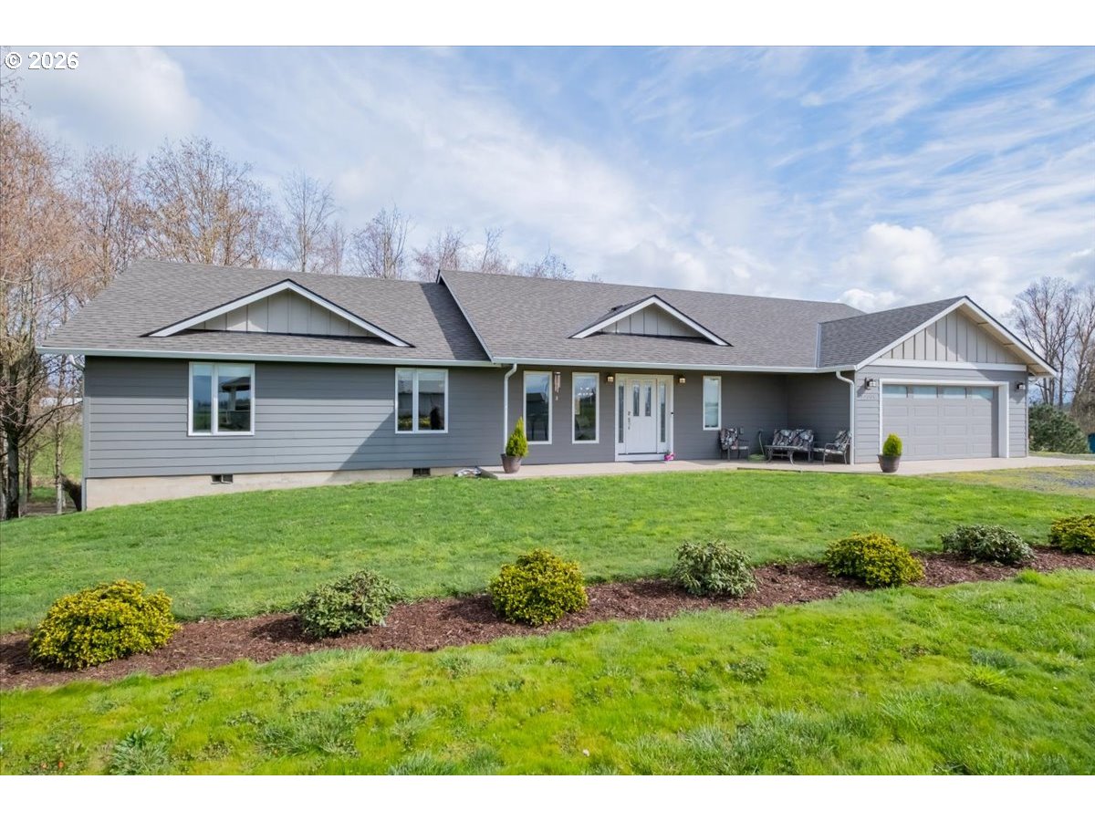 12008 Duck Inn Road Northeast Gervais, OR 97026 - Photo 1 of 48 a view of a house with yard and a garden