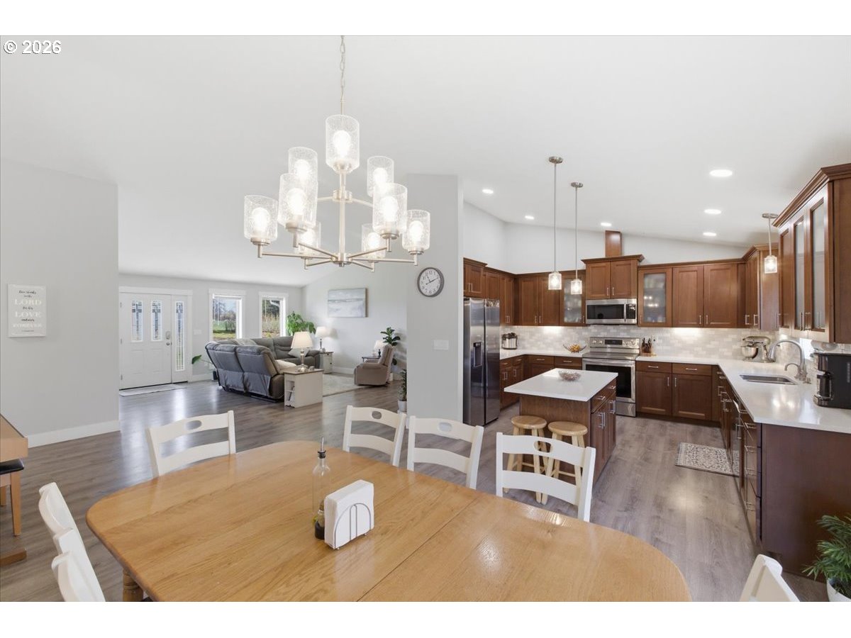 12008 Duck Inn Road Northeast Gervais, OR 97026 - Photo 13 of 48 a living room with lots of furniture and kitchen view