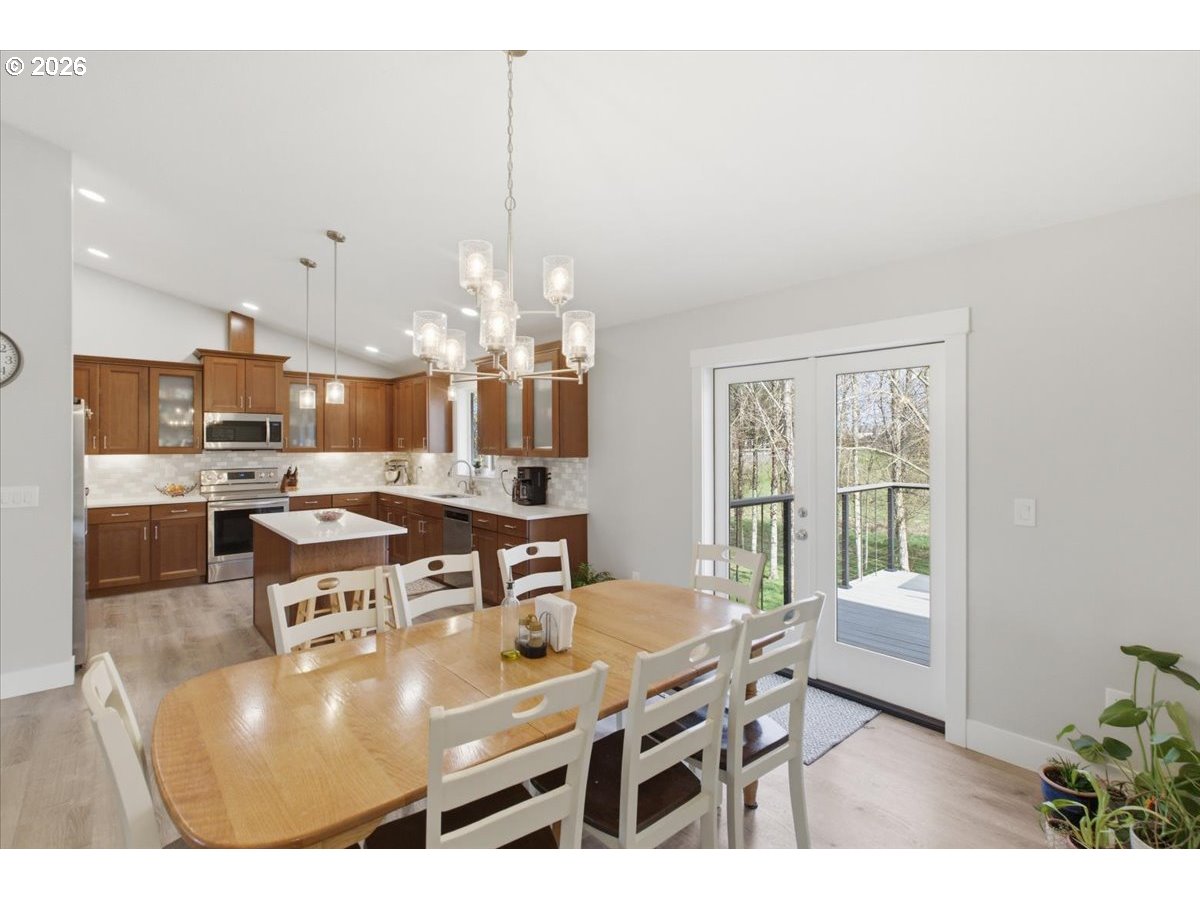 12008 Duck Inn Road Northeast Gervais, OR 97026 - Photo 14 of 48 a view of a dining room with furniture and chandelier